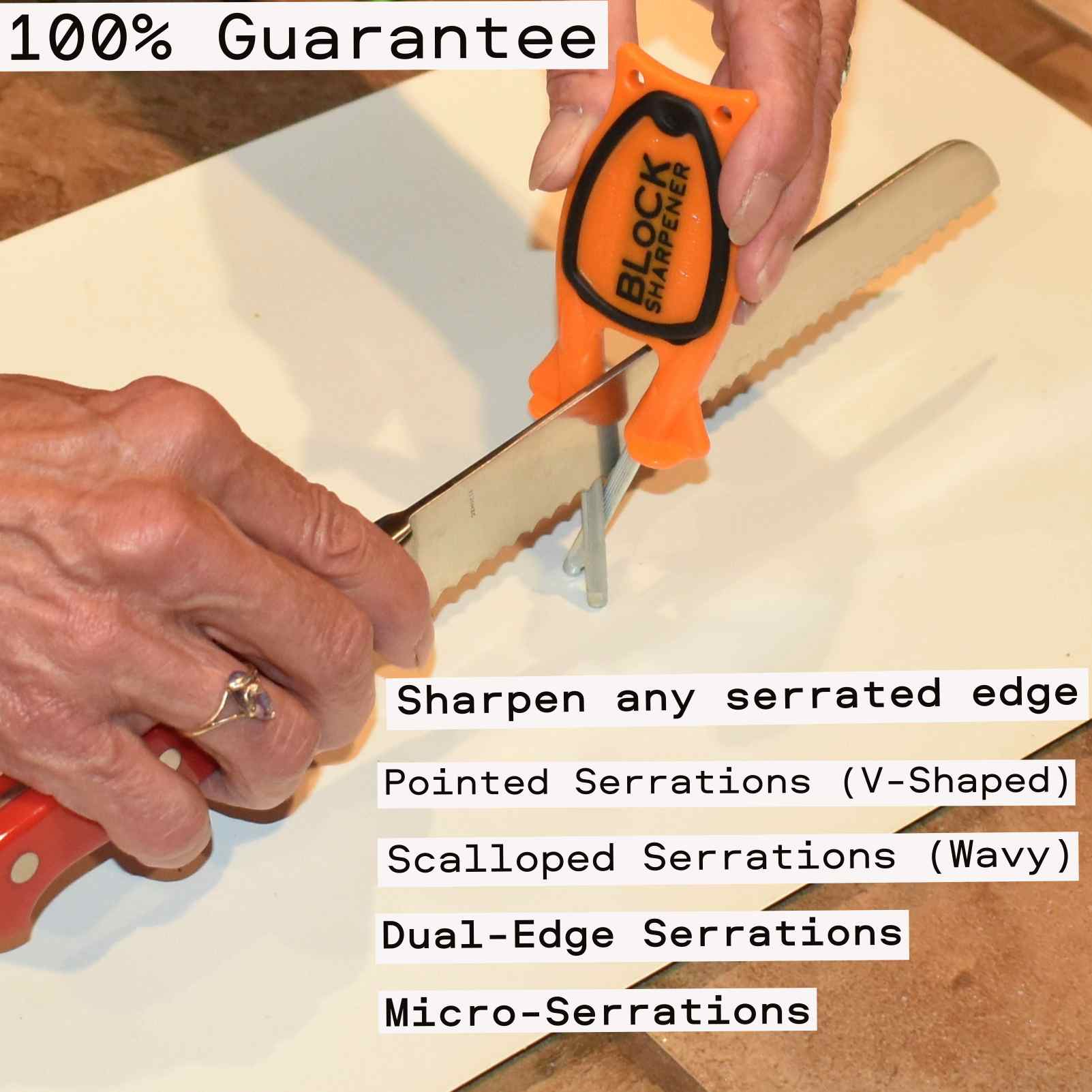 Hand holding an orange Block Sharpener showing the black non-slip grip and compact size.