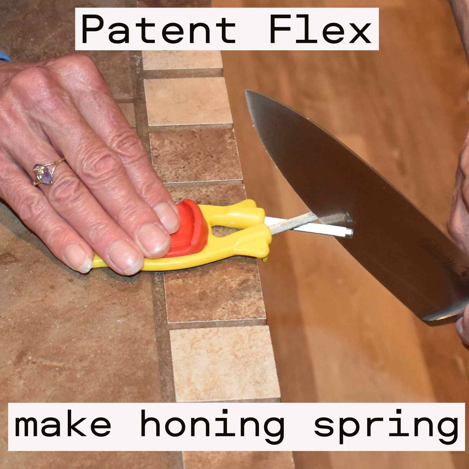 Chef knife being sharpen with a yellow Block sharpener.