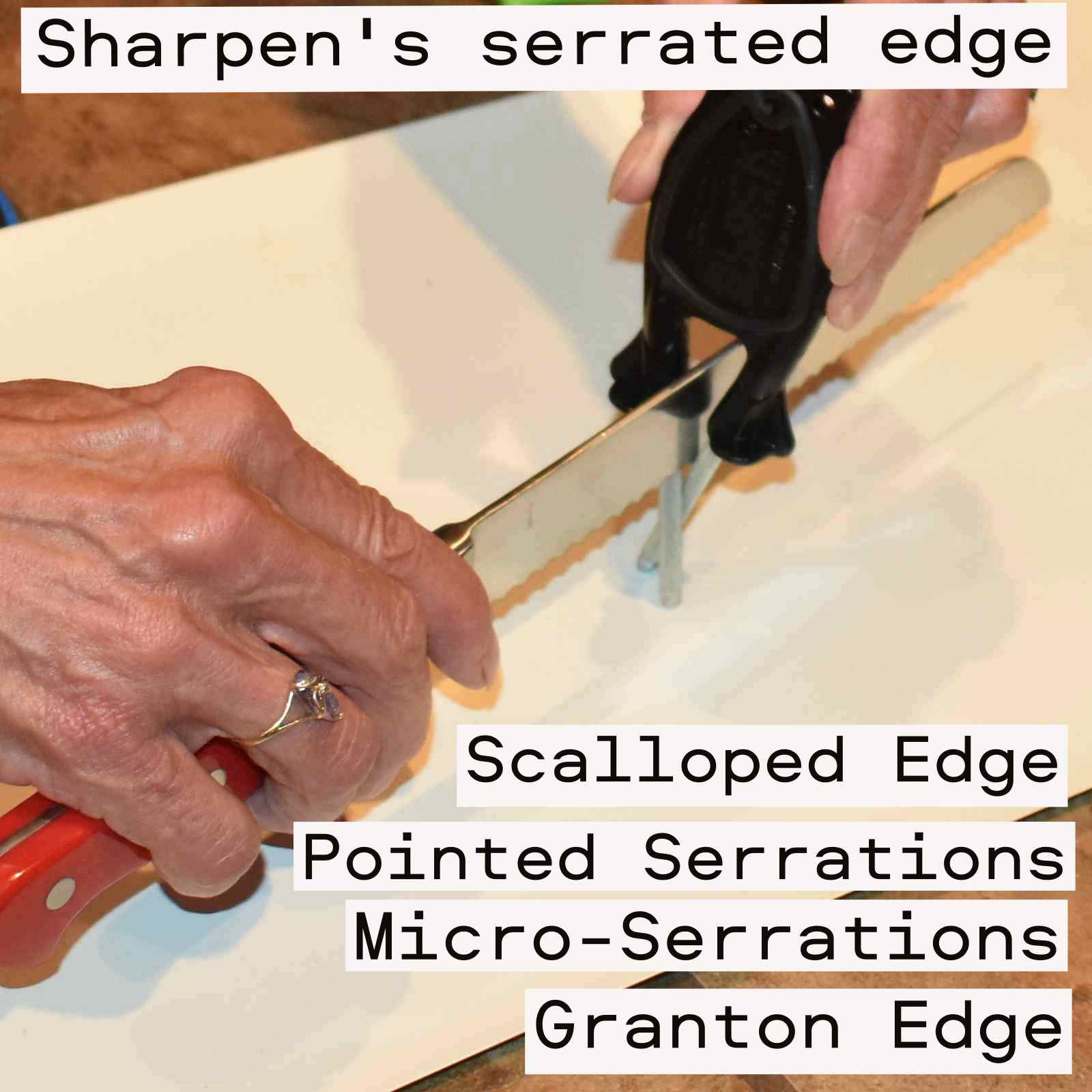 Handheld Black Block Knife Sharpener being used to sharpen a long-serrated bread knife on a kitchen countertop.