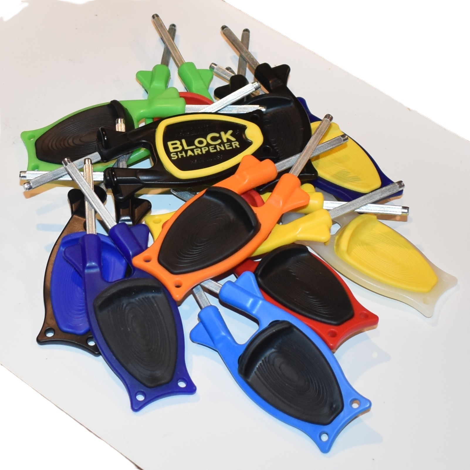 Handheld manual knife sharpeners by Block Sharpener shown in a variety of vibrant nonslip grip colors