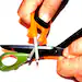Orange hunting knife sharpener made by Paul Block sharpening scissors