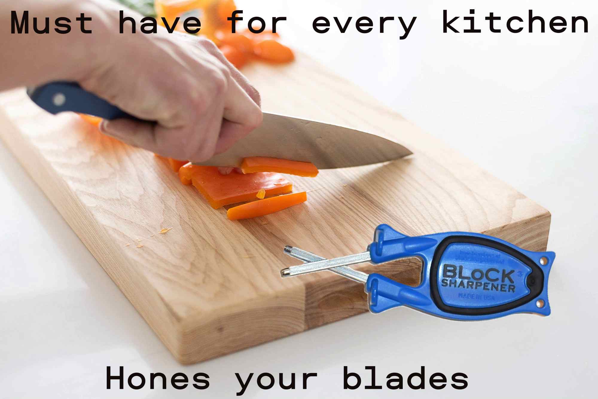 Blue Block Knife Sharpener sitting on a kitchen cutting board next to fresh vegetables and cutlery.