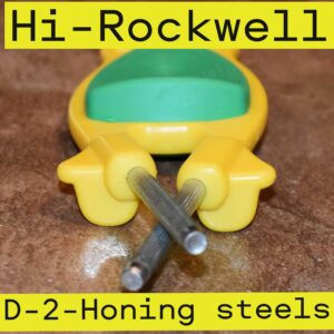 Yellow with green grip Block sharpener with two honing steels out the front end,