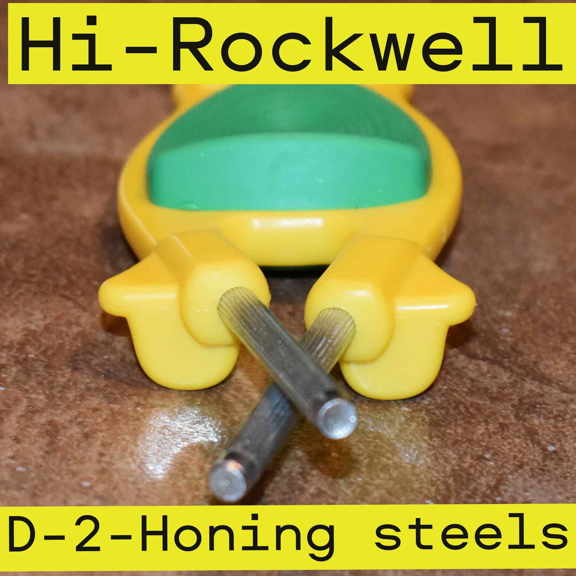 Yellow with green grip Block sharpener with two honing steels out the front end,