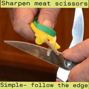 sharpening scissors with a Block sharpener holding in hand with green nonslip thumb grip 